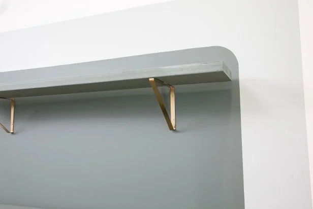 A Shelf on a Green Accent Wall
